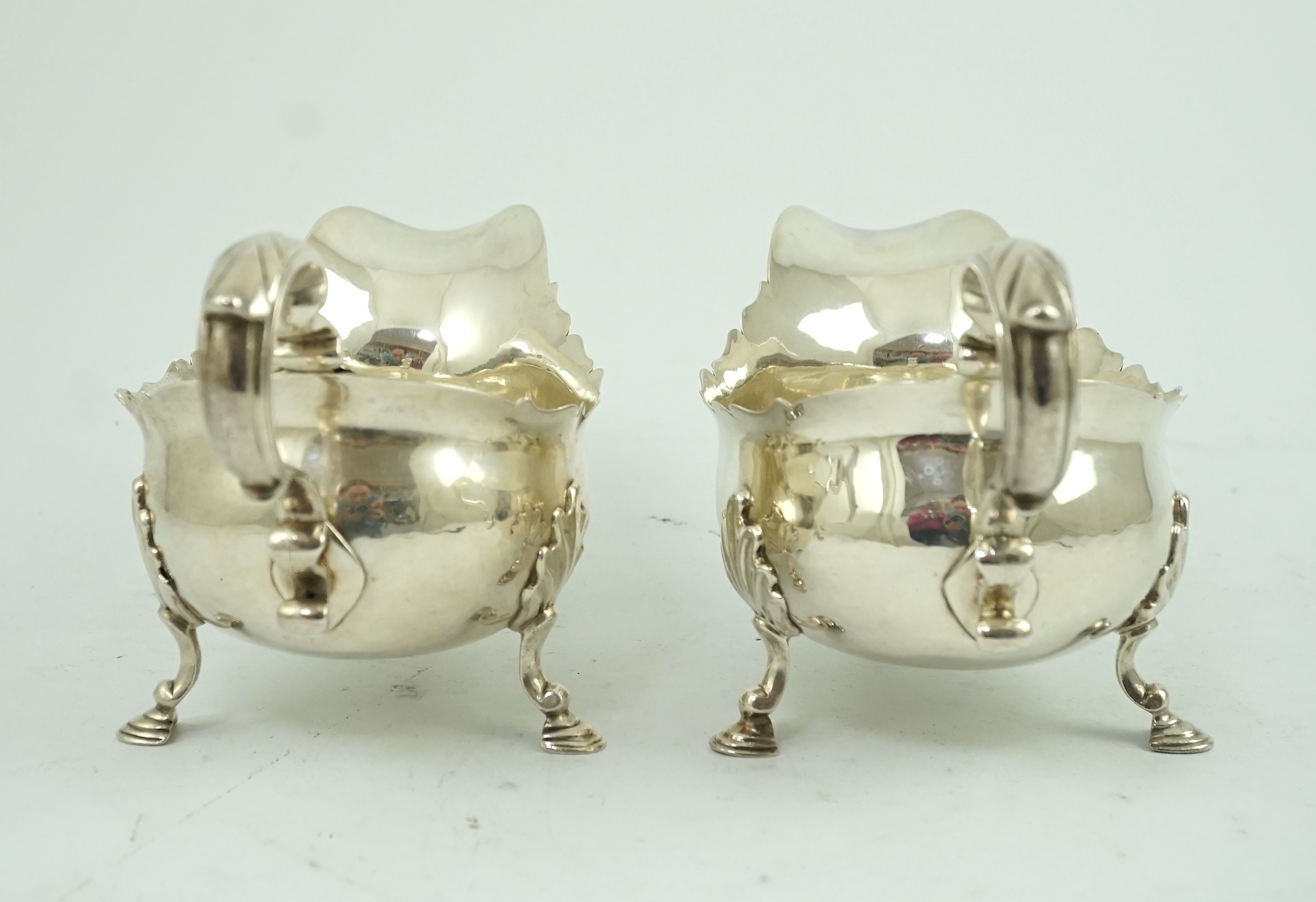 A pair of late George II silver sauceboats by Robert Albin Cox